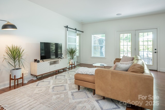 19 Lynnbrook Way, Columbus, NC 28722 - living area featuring wood finished floors, a barn door, and baseboards