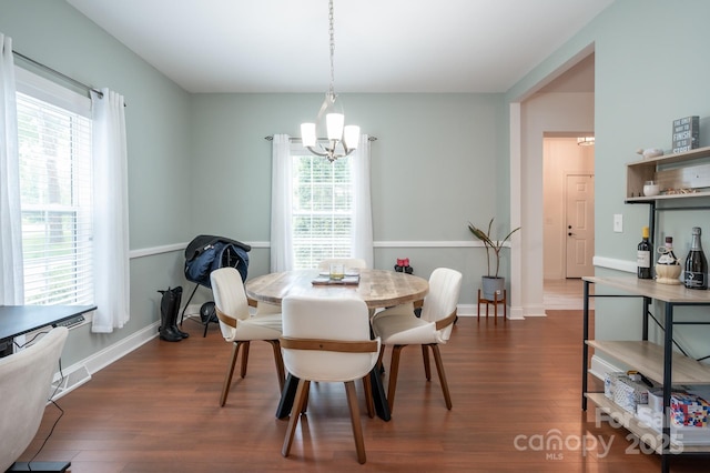 19 Lynnbrook Way, Columbus, NC 28722 - dining room featuring a chandelier, dark wood-style floors, and baseboards