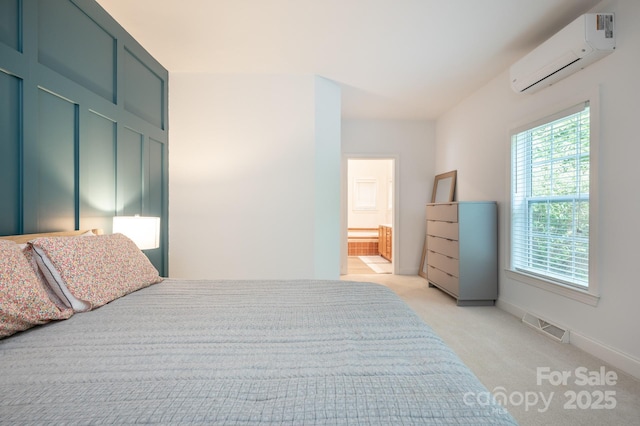 19 Lynnbrook Way, Columbus, NC 28722 - bedroom with a wall mounted AC, light carpet, baseboards, and ensuite bath