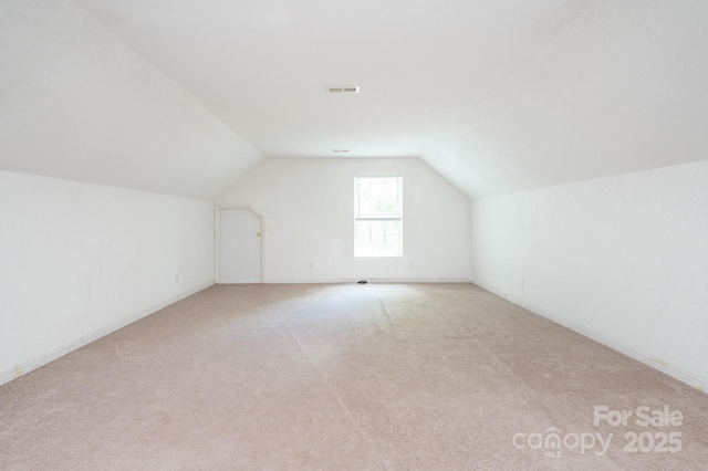 19 Lynnbrook Way, Columbus, NC 28722 - bonus room with vaulted ceiling, light colored carpet, and baseboards