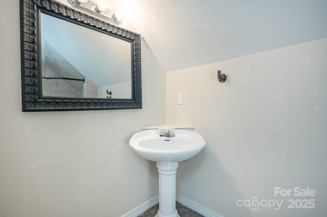 19 Lynnbrook Way, Columbus, NC 28722 - bathroom with lofted ceiling and baseboards