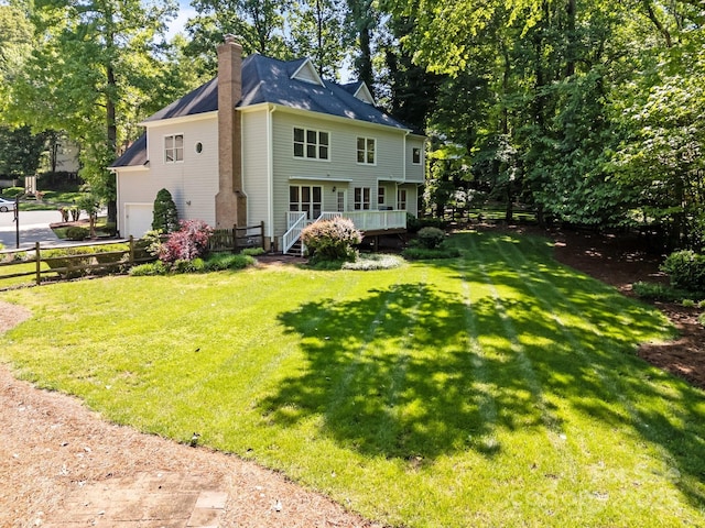 15831 Breton Brook St, Huntersville, NC 28078 - back of house with a chimney, a deck, and a garage