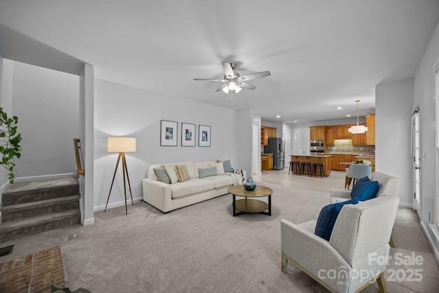 15831 Breton Brook St, Huntersville, NC 28078 - living area featuring light carpet, baseboards, recessed lighting, stairs, and a ceiling fan