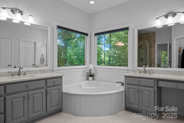 15831 Breton Brook St, Huntersville, NC 28078 - bathroom featuring a shower stall, a garden tub, two vanities, and tile patterned floors
