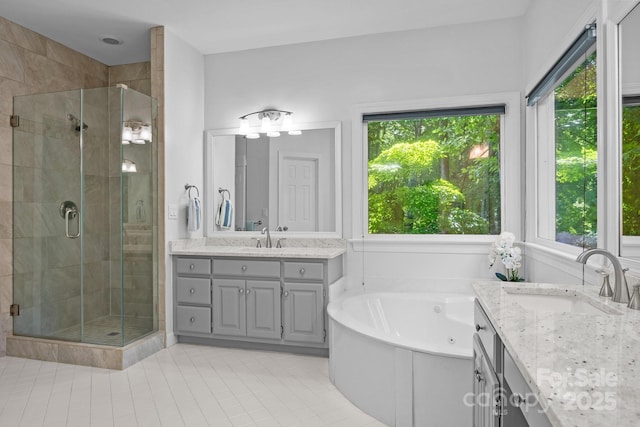 15831 Breton Brook St, Huntersville, NC 28078 - bathroom featuring plenty of natural light, a shower stall, tile patterned floors, and vanity