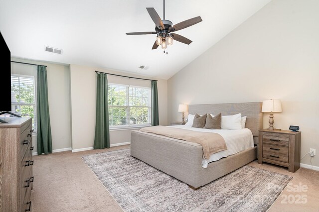 bedroom with carpet flooring, multiple windows, baseboards, and high vaulted ceiling