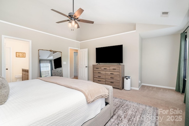 bedroom featuring carpet, baseboards, high vaulted ceiling, ceiling fan, and ensuite bathroom