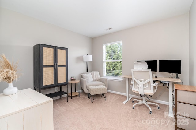 office space with light colored carpet and baseboards