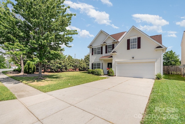 traditional-style home featuring concrete driveway and an attached garage