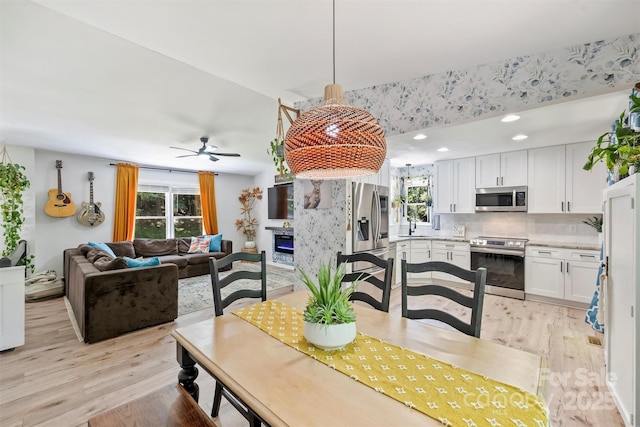 27037 Tidal Way, Tega Cay, SC 29708 - dining space with light wood-style floors, a ceiling fan, and recessed lighting