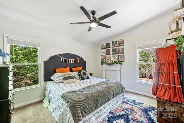 27037 Tidal Way, Tega Cay, SC 29708 - bedroom featuring multiple windows, carpet, vaulted ceiling, and baseboards