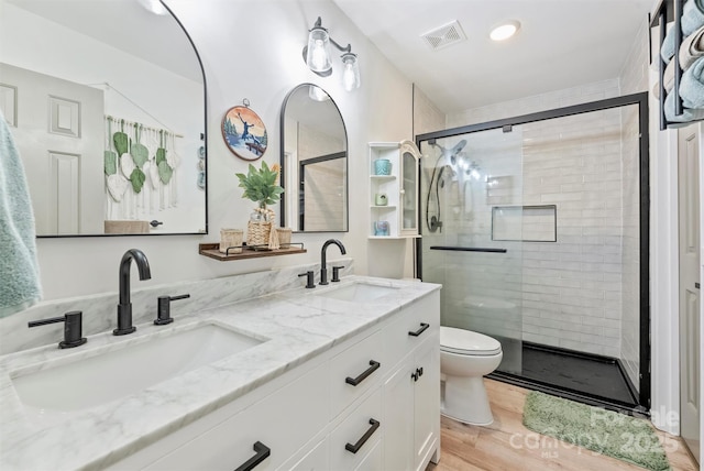 27037 Tidal Way, Tega Cay, SC 29708 - full bathroom featuring toilet, a shower stall, double vanity, and wood finished floors