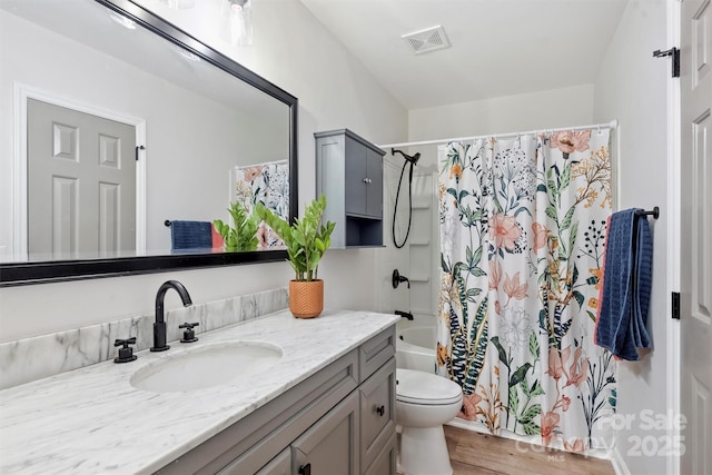 27037 Tidal Way, Tega Cay, SC 29708 - full bathroom with vanity, toilet, wood finished floors, and shower / tub combo