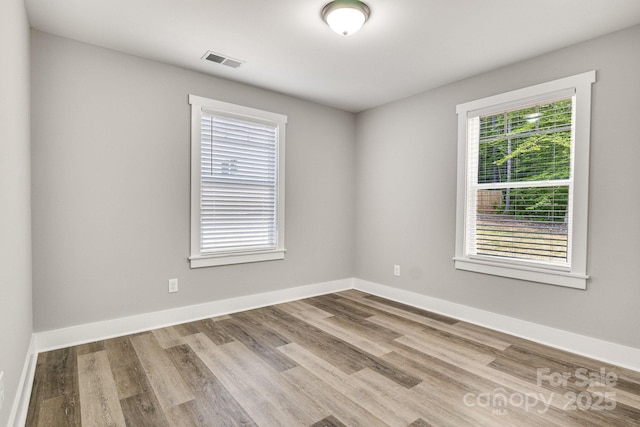 1222 Summerhill St SW, Lenoir, NC 28645 - spare room with wood finished floors and baseboards