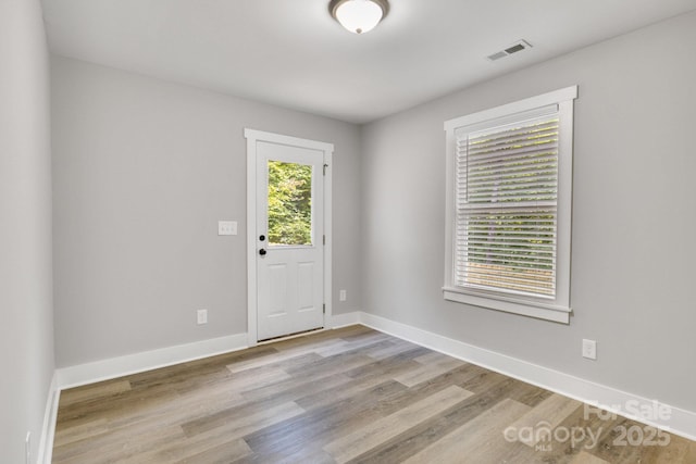 1222 Summerhill St SW, Lenoir, NC 28645 - unfurnished room with wood finished floors