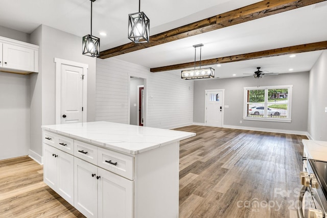 1222 Summerhill St SW, Lenoir, NC 28645 - kitchen featuring light wood-style flooring, open floor plan, white cabinets, beamed ceiling, and recessed lighting