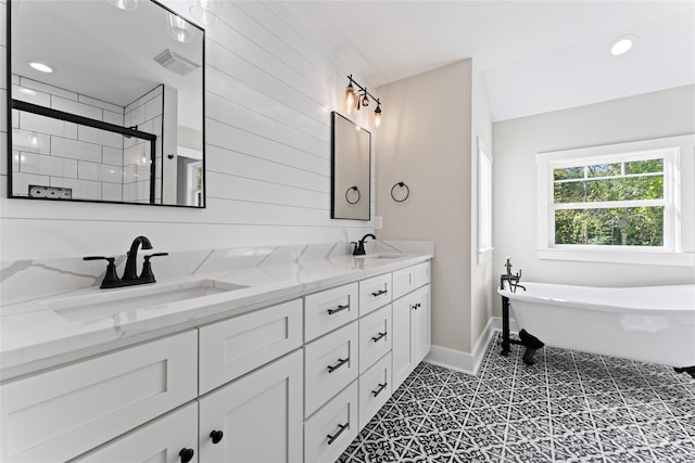 1222 Summerhill St SW, Lenoir, NC 28645 - full bathroom featuring double vanity, a soaking tub, a tile shower, and recessed lighting