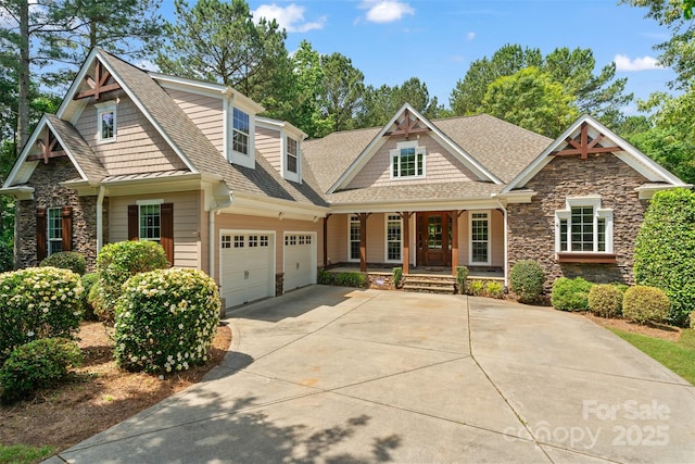 104 Whiterock Dr, Mount Holly, NC 28120 - craftsman-style house featuring covered porch, stone siding, a shingled roof, and driveway