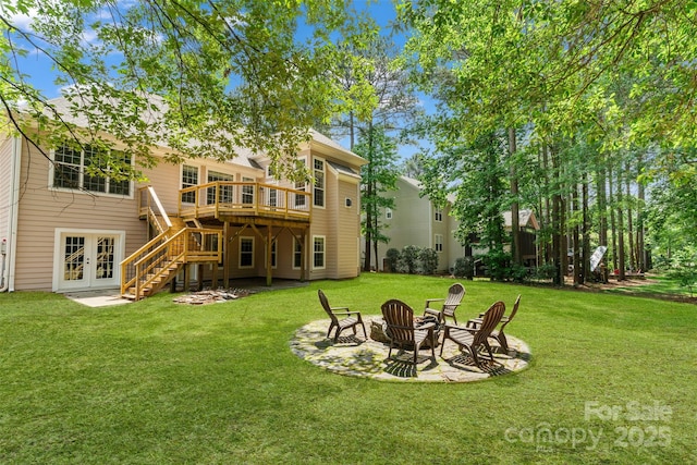 104 Whiterock Dr, Mount Holly, NC 28120 - rear view of property with french doors, a fire pit, stairs, a wooden deck, and a lawn