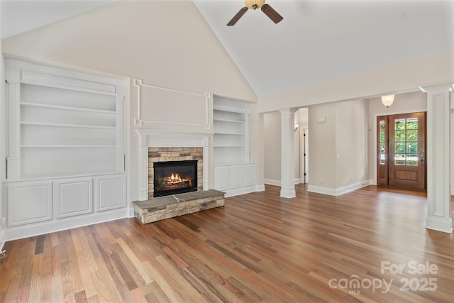 104 Whiterock Dr, Mount Holly, NC 28120 - unfurnished living room with ornate columns, ceiling fan, high vaulted ceiling, built in features, and wood finished floors