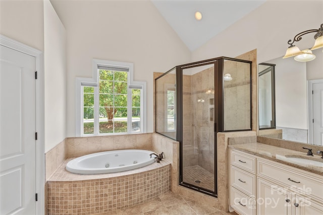 104 Whiterock Dr, Mount Holly, NC 28120 - bathroom with a stall shower, a whirlpool tub, vanity, vaulted ceiling, and tile patterned floors