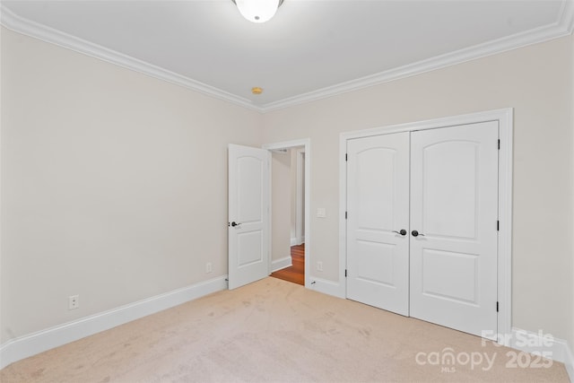 104 Whiterock Dr, Mount Holly, NC 28120 - unfurnished bedroom featuring ornamental molding, carpet flooring, a closet, and baseboards