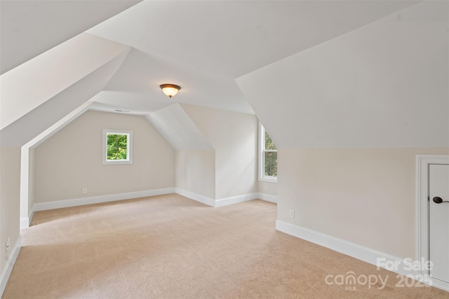 104 Whiterock Dr, Mount Holly, NC 28120 - bonus room with light colored carpet, vaulted ceiling, and baseboards