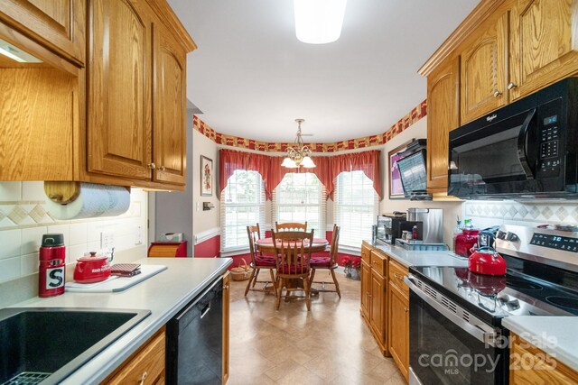kitchen with black microwave, stainless steel electric range oven, dishwasher, light countertops, and backsplash