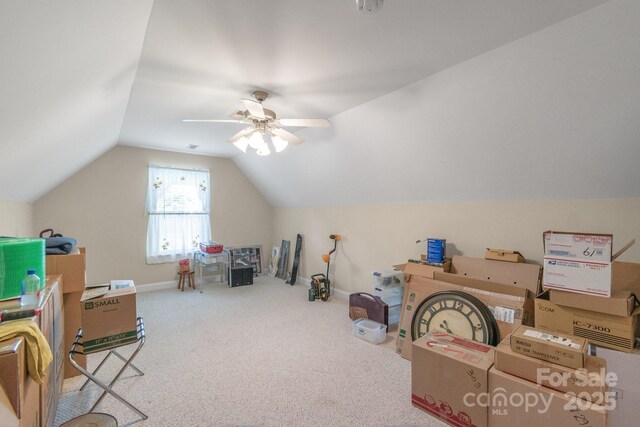 bonus room with vaulted ceiling, carpet flooring, ceiling fan, and baseboards