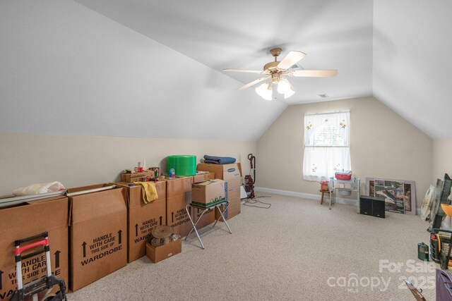 additional living space with carpet, lofted ceiling, ceiling fan, and baseboards
