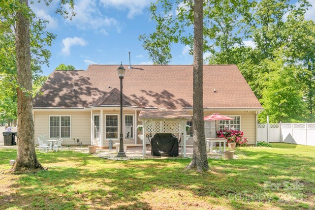 rear view of property featuring a patio