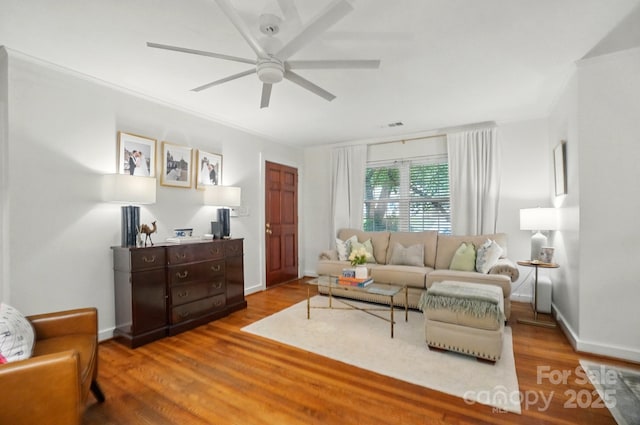 4647 General Pershing Dr, Charlotte, NC 28209 - living room featuring ceiling fan, wood finished floors, crown molding, and baseboards