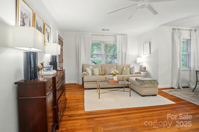 4647 General Pershing Dr, Charlotte, NC 28209 - living room with light wood finished floors, a ceiling fan, and baseboards