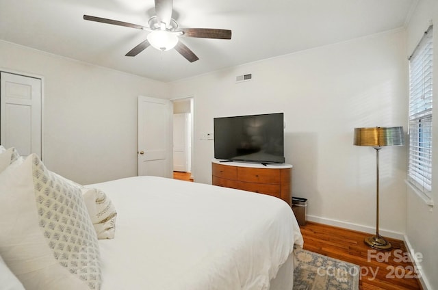 4647 General Pershing Dr, Charlotte, NC 28209 - bedroom featuring wood finished floors, baseboards, ornamental molding, and ceiling fan
