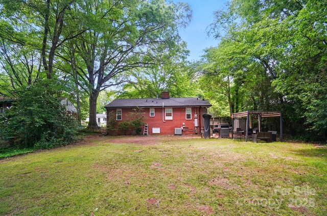 4647 General Pershing Dr, Charlotte, NC 28209 - rear view of property with a lawn, brick siding, and a chimney