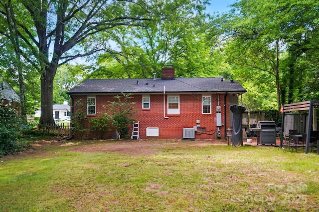 4647 General Pershing Dr, Charlotte, NC 28209 - back of house with central AC, brick siding, and a chimney