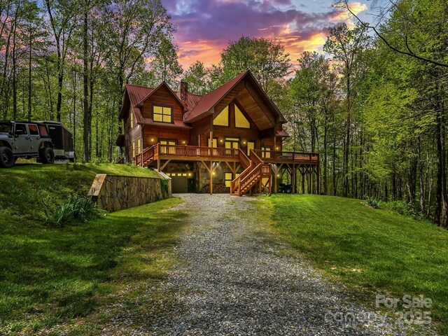 917 Otter Mountain Rd, Topton, NC 28781 - chalet / cabin with stairs, gravel driveway, a chimney, a front lawn, and metal roof