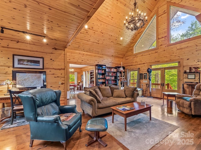 917 Otter Mountain Rd, Topton, NC 28781 - living room with wooden walls, high vaulted ceiling, hardwood / wood-style floors, and a chandelier