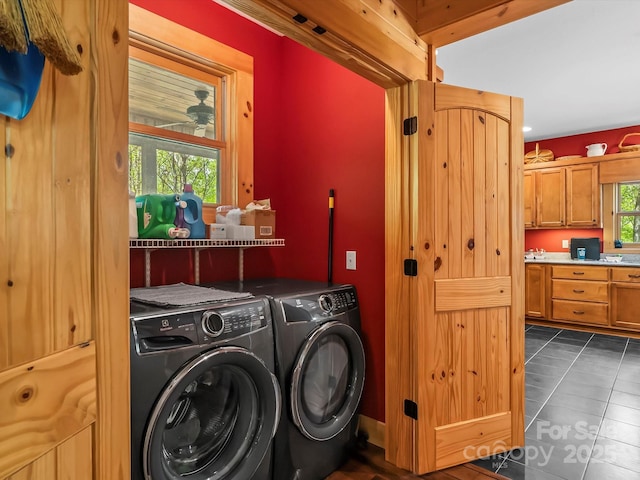 917 Otter Mountain Rd, Topton, NC 28781 - clothes washing area with washer and clothes dryer and dark tile patterned flooring