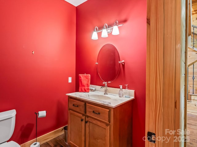 917 Otter Mountain Rd, Topton, NC 28781 - half bathroom with toilet, wood finished floors, vanity, and baseboards