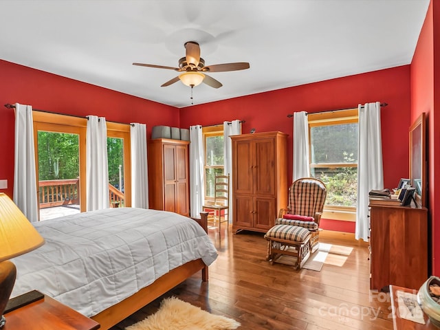 917 Otter Mountain Rd, Topton, NC 28781 - bedroom featuring access to outside, multiple windows, and hardwood / wood-style flooring