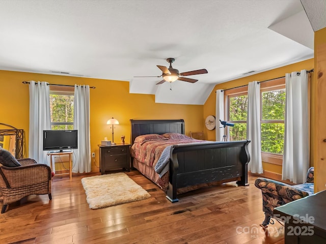 917 Otter Mountain Rd, Topton, NC 28781 - bedroom with wood-type flooring, vaulted ceiling, and a ceiling fan