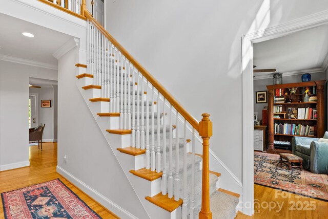 50 Pinerose Dr, Weaverville, NC 28787 - stairway with crown molding, wood finished floors, baseboards, and recessed lighting