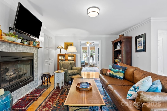 50 Pinerose Dr, Weaverville, NC 28787 - living room featuring light wood-style flooring, a fireplace, ornamental molding, and ceiling fan