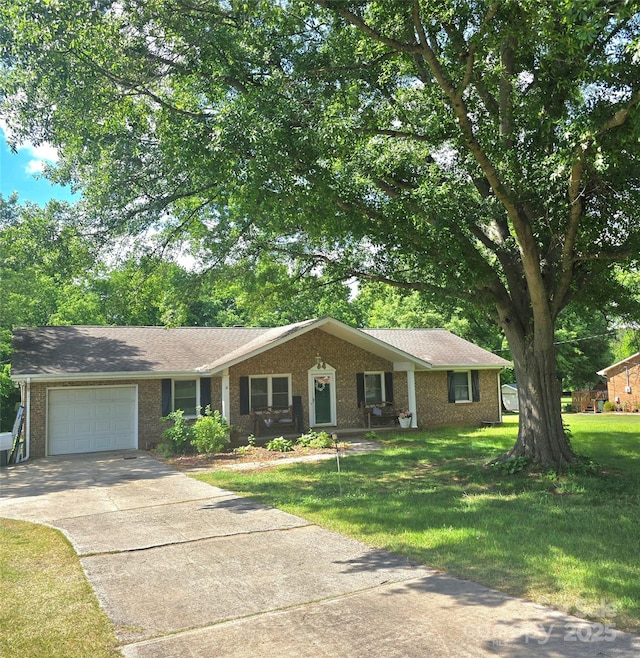 6573 Weldon Cir NW Unit 22, Concord, NC 28027 - ranch-style home featuring an attached garage, driveway, brick siding, and a front yard