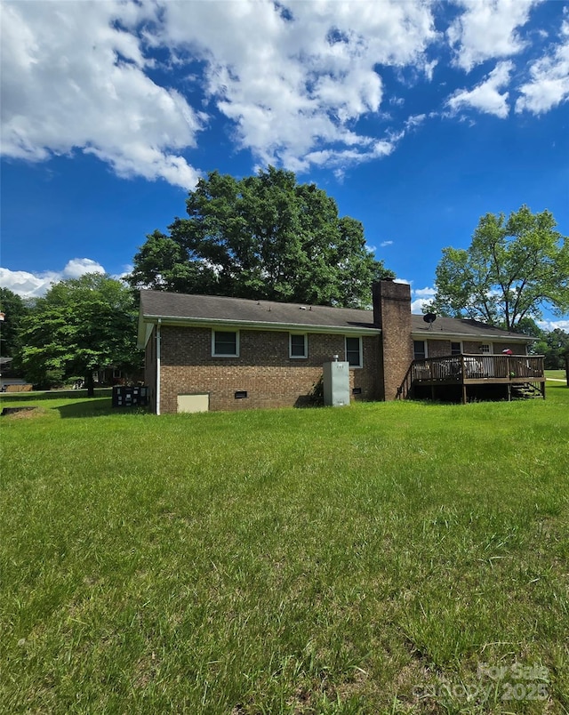 6573 Weldon Cir NW Unit 22, Concord, NC 28027 - back of house featuring a wooden deck, a lawn, brick siding, and crawl space