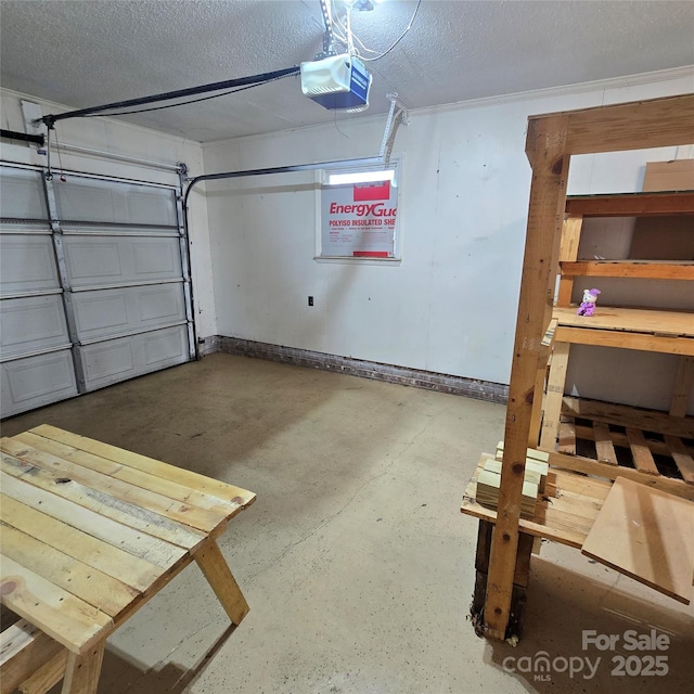 6573 Weldon Cir NW Unit 22, Concord, NC 28027 - garage featuring a garage door opener and baseboards