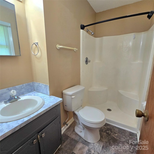 6573 Weldon Cir NW Unit 22, Concord, NC 28027 - full bathroom featuring toilet, vanity, and a shower