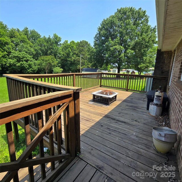 6573 Weldon Cir NW Unit 22, Concord, NC 28027 - wooden terrace featuring a fire pit