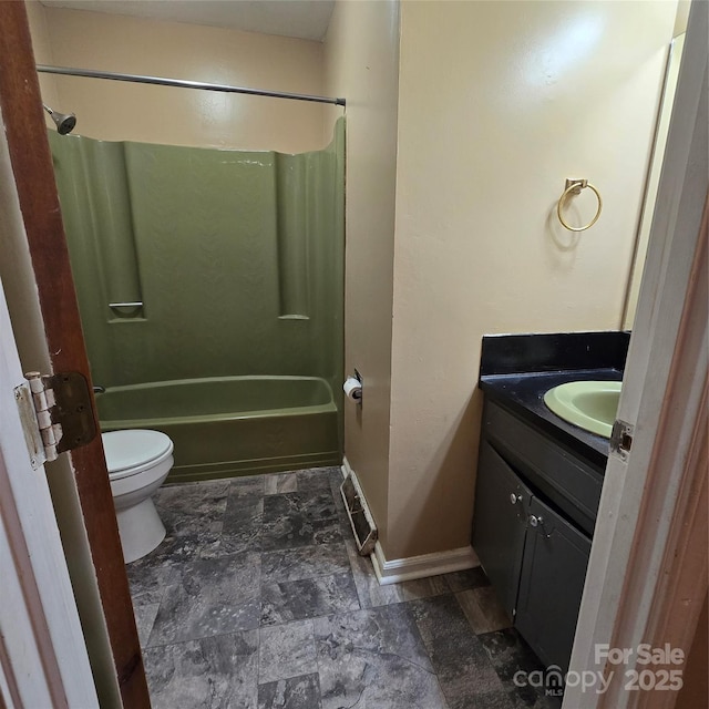 6573 Weldon Cir NW Unit 22, Concord, NC 28027 - bathroom with vanity, toilet, washtub / shower combination, and baseboards